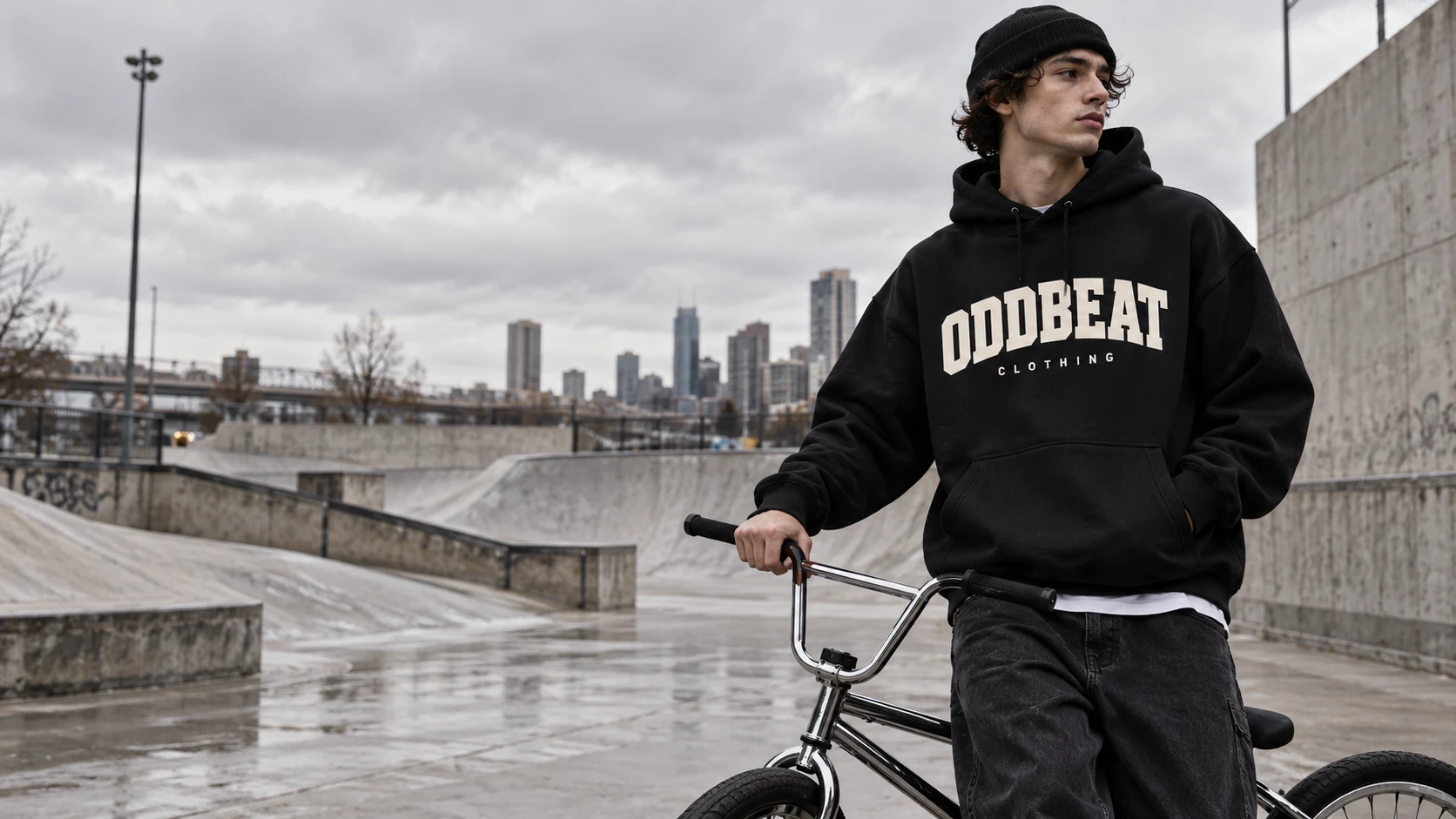 Oddbeat streetwear and a chrome BMX at a concrete skatepark