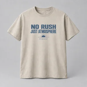 No Rush Just Atmosphere Tee in stone with a compact chest print — concept mockup