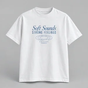 Soft Sounds Strong Feelings Tee in white with a compact chest print — concept mockup