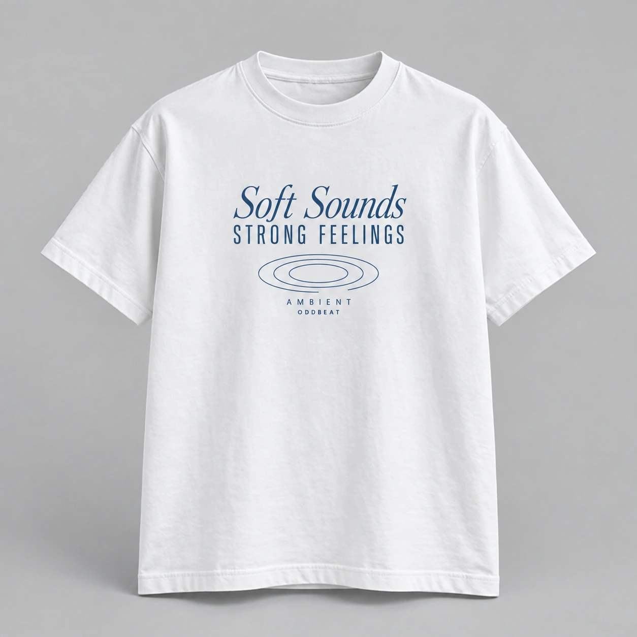 Soft Sounds Strong Feelings Tee in white with a compact chest print — concept mockup