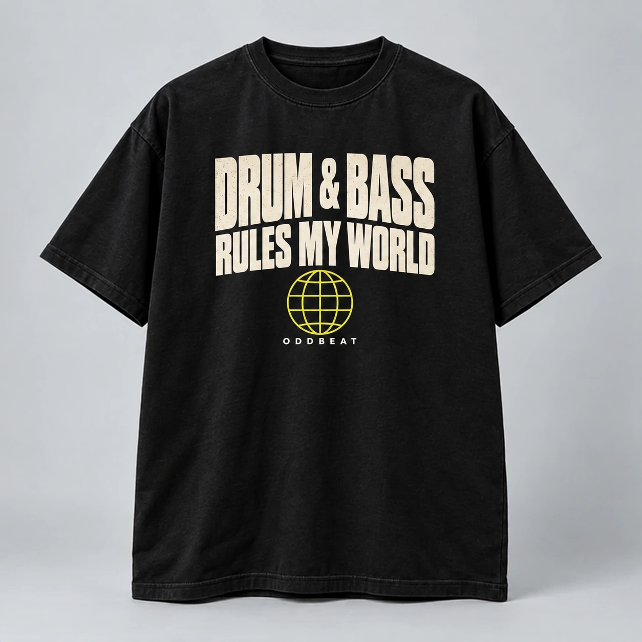 Drum & Bass Rules My World Tee in black with a compact chest print — concept mockup