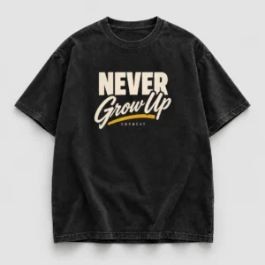 Never Grow Up Tee in washed black with a compact chest print — concept mockup