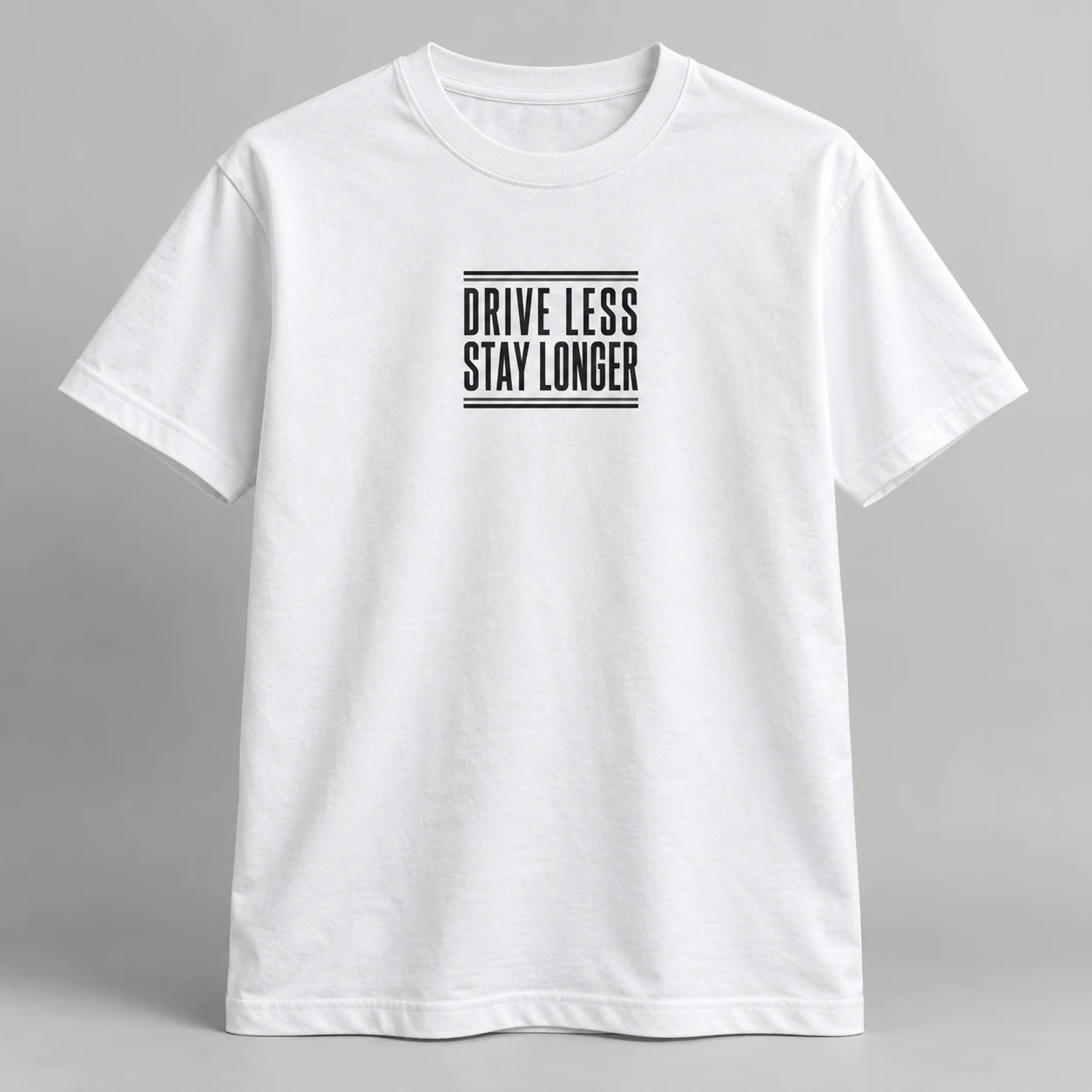 Drive Less Stay Longer Tee in White / Ink Black — compact graphic concept mockup