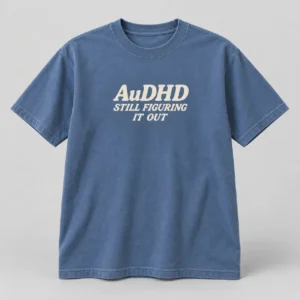 AuDHD Still Figuring It Out Tee in Faded Blue / Cream — compact graphic concept mockup