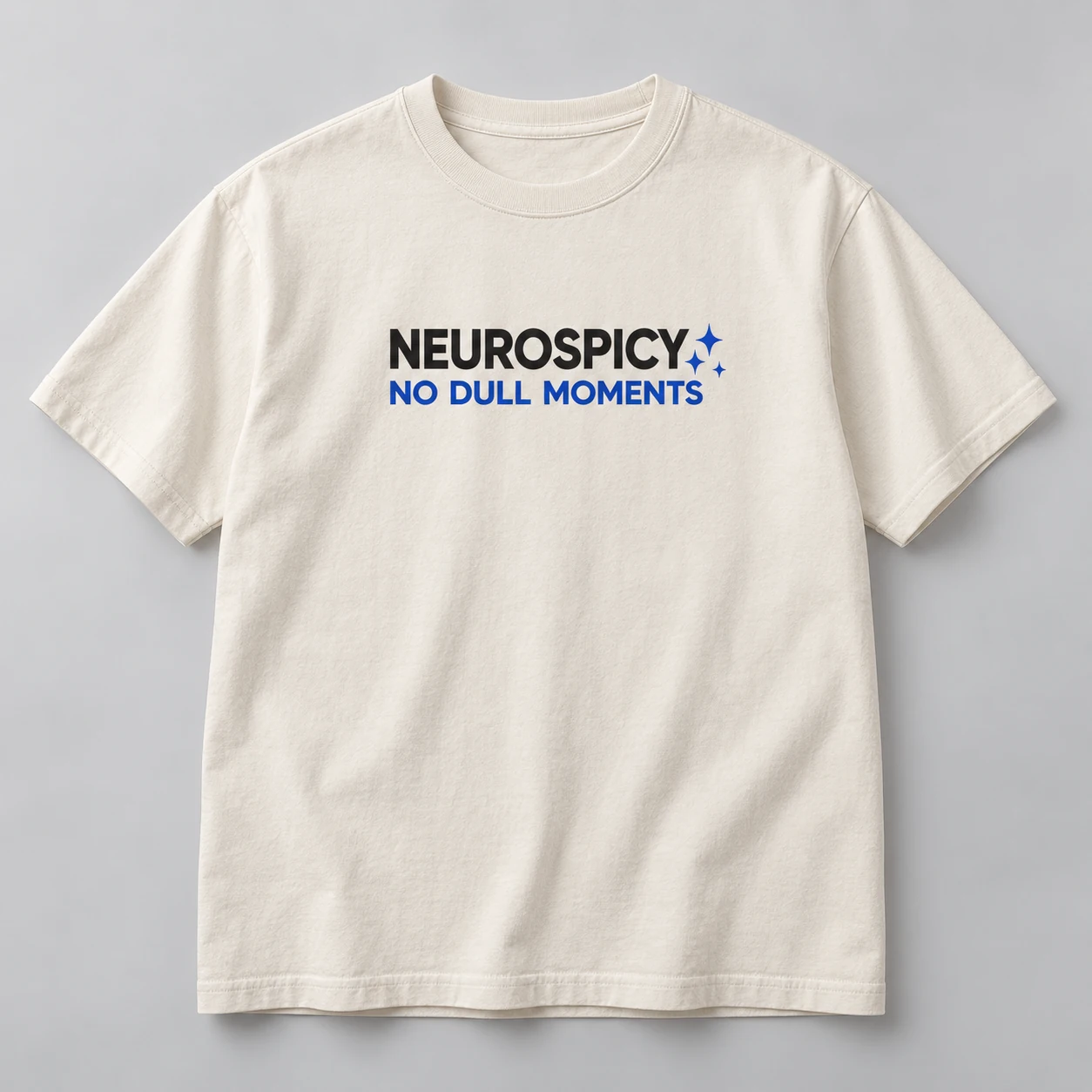 Neurospicy No Dull Moments Tee in Natural / Ink Black — compact graphic concept mockup