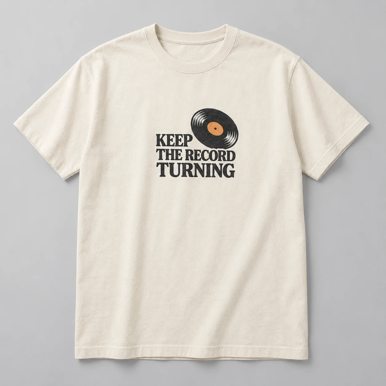 Keep The Record Turning Tee in Natural / Ink Black — compact graphic concept mockup