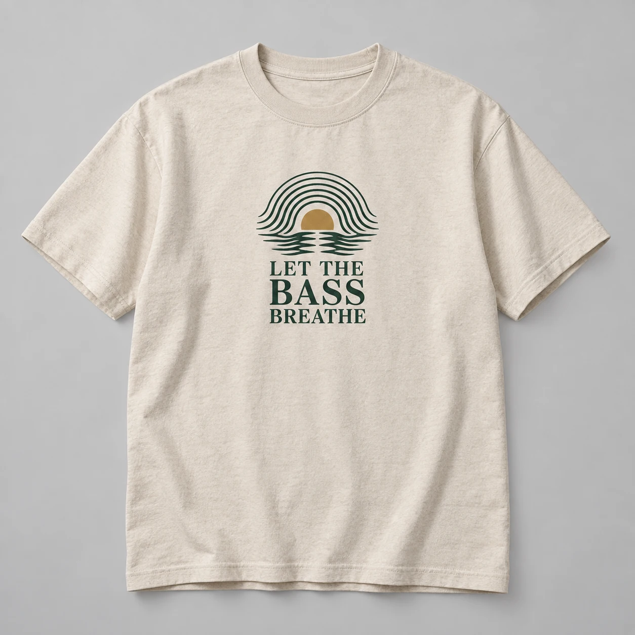 Let The Bass Breathe Tee in Oat / Forest — compact graphic concept mockup