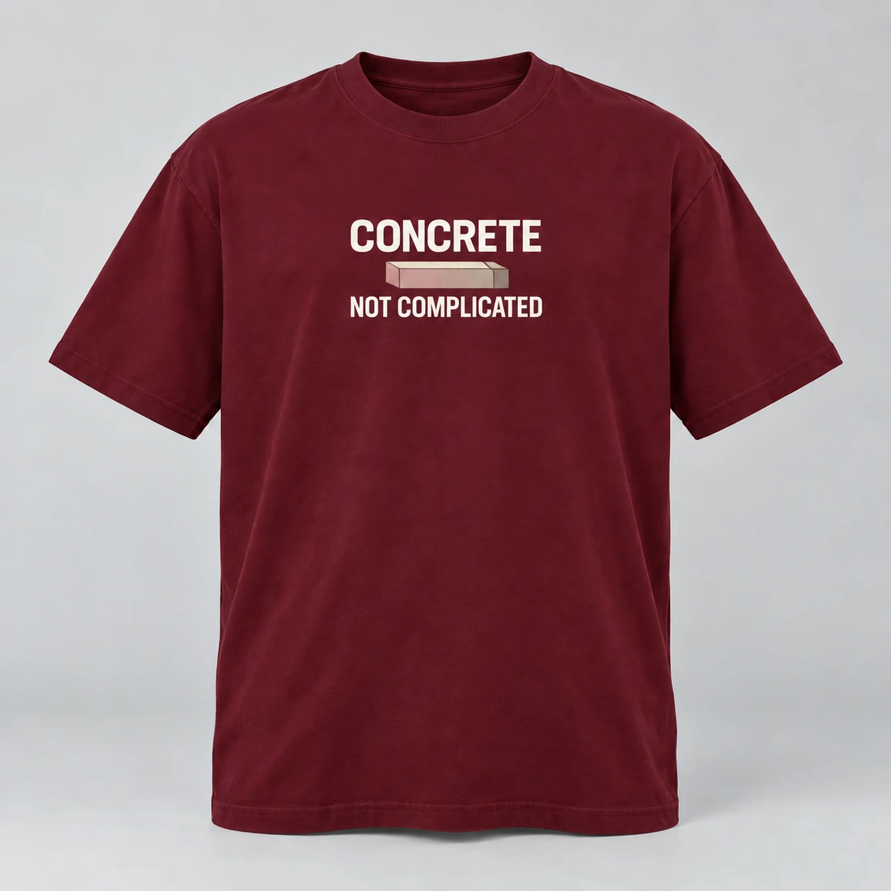 Concrete Not Complicated Tee in Burgundy / Cream — compact graphic concept mockup