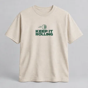 Keep It Rolling Tee in Oat / Forest — compact graphic concept mockup