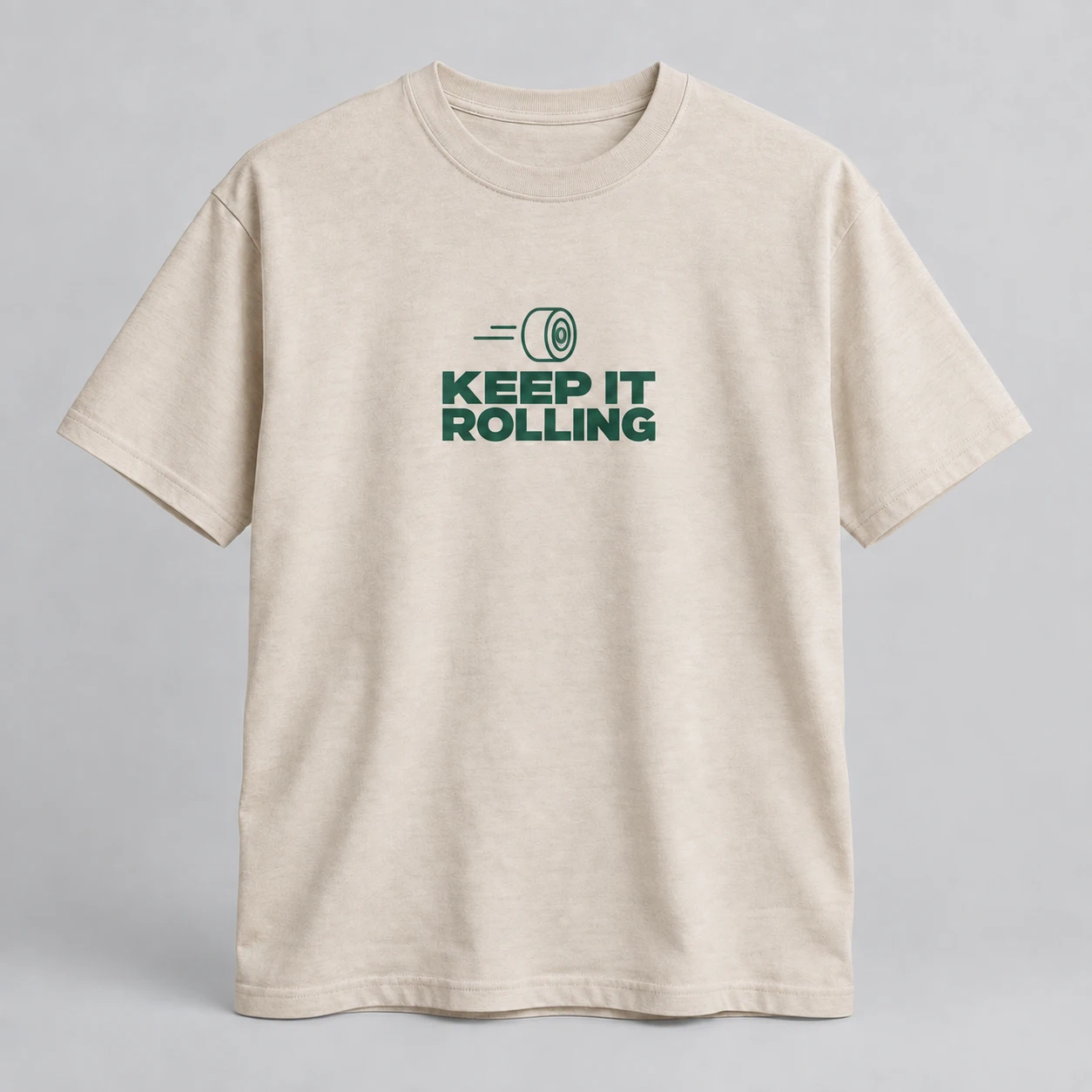Keep It Rolling Tee in Oat / Forest — compact graphic concept mockup