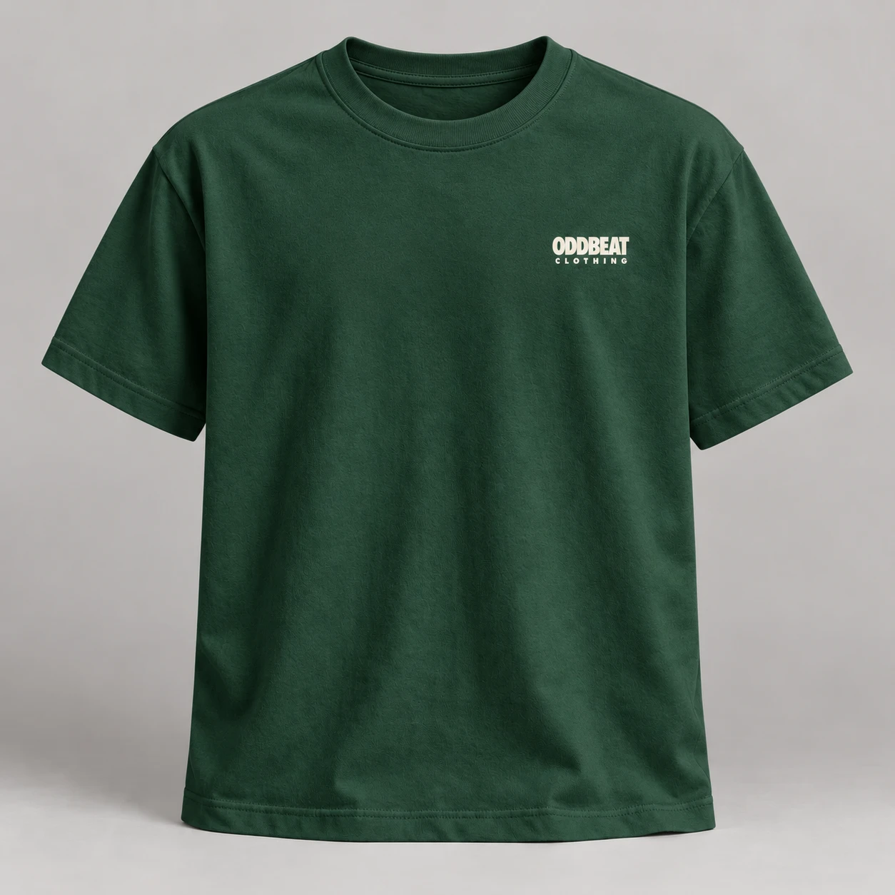 Micro Logo Tee — Forest in Forest / Cream with micro Oddbeat logo — concept mockup