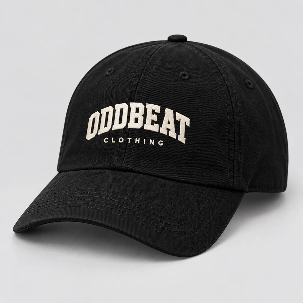Varsity Cap — Black in Black / Cream with varsity Oddbeat logo — concept mockup