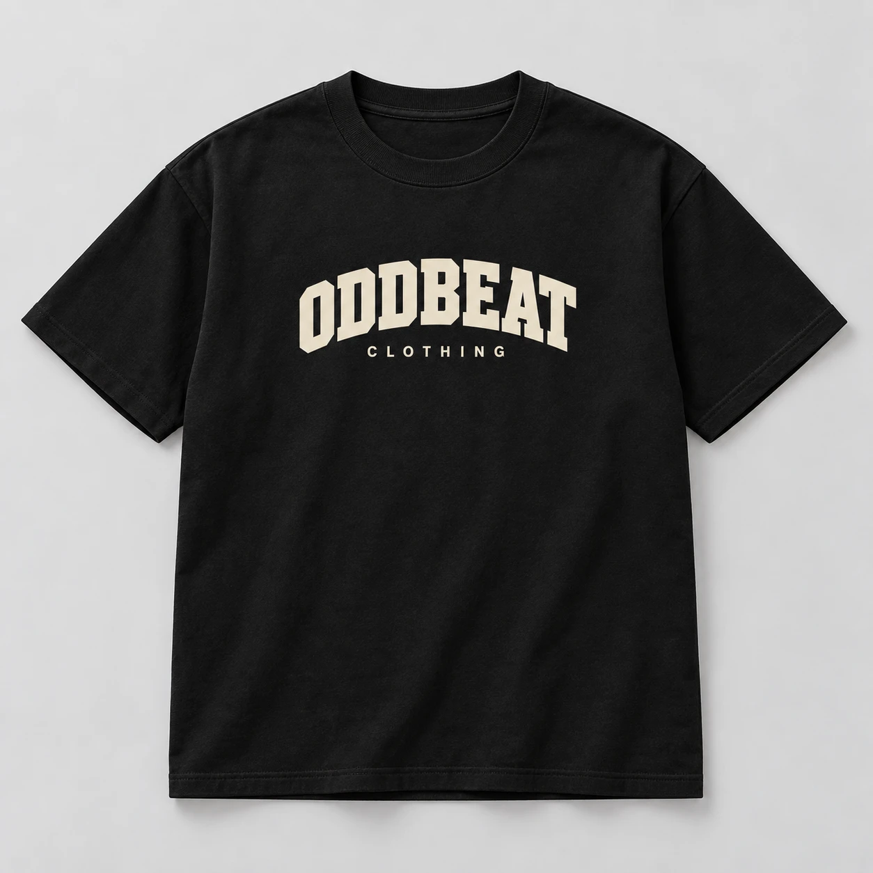 Hero Varsity Tee — Black in Black / Cream with varsity Oddbeat logo — concept mockup