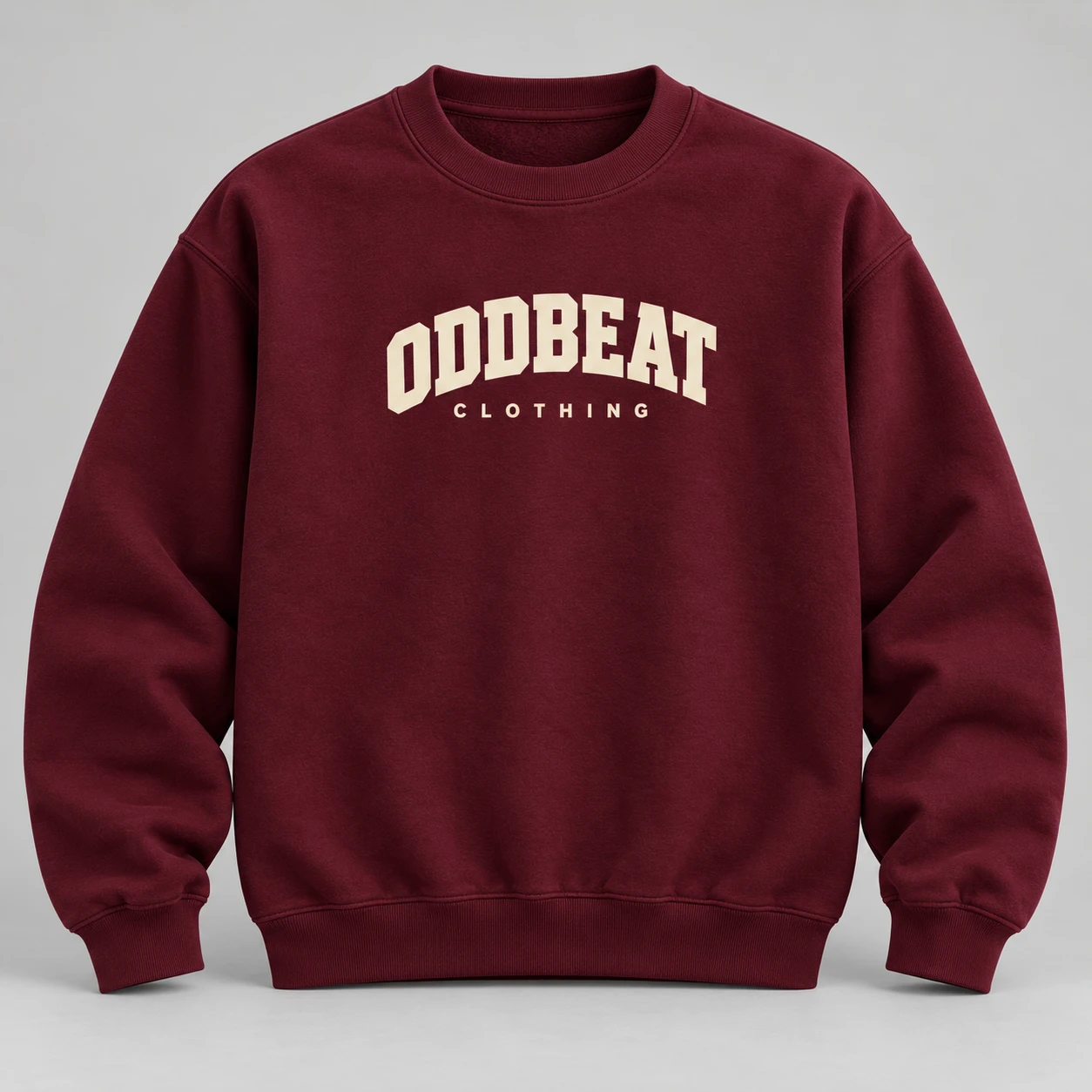 Varsity Sweatshirt — Burgundy in Burgundy / Cream with varsity Oddbeat logo — concept mockup